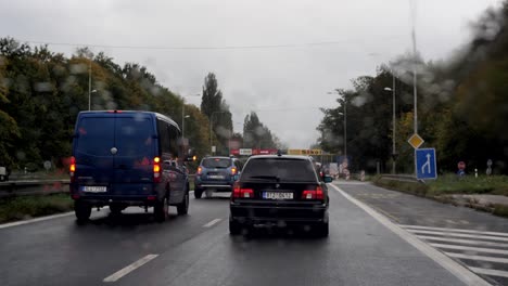 Older-BMW-530d-Touring-car-driving-on-a-road-through-construction-site-showing-the-zipper-rule-in-Czech-Republic