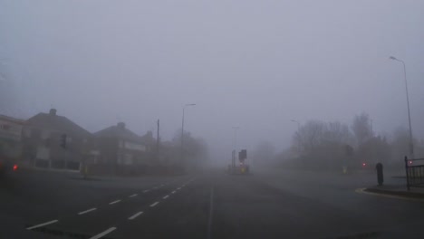 POV-dashboard-driving-in-British-fog-weather-urban-road-traffic