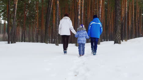 Mother-Walks-With-Her-Two-Children-In-Snow-01