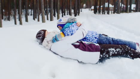 Mother-And-Daughter-Playing-Around-In-The-Snow-02