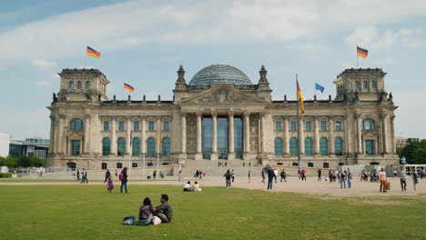 Tourists-And-Locals-Resting-On-The-Lawn-Near-The-Bundestag-Building