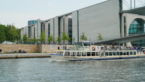A-Pleasure-Boat-With-Tourists-Against-The-Architecture-Of-Berlin-01
