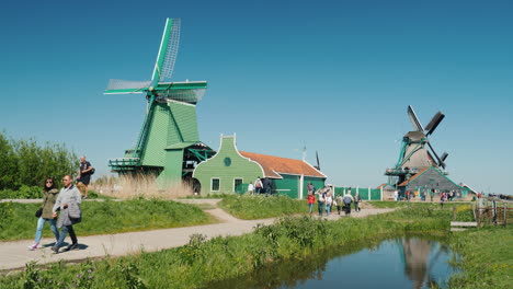 Tourists-Among-Old-Mills-The-Netherlands