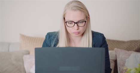 Female-Entrepreneur-Using-Laptop-In-Office-2
