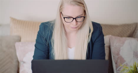 Female-Entrepreneur-Using-Laptop-In-Office-5