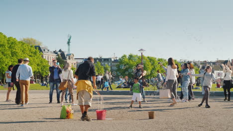 Man-Blows-Bubbles-For-Tourists