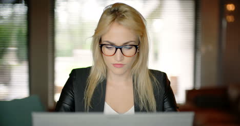 Young-Woman-Working-Until-Late-Evening-In-Office