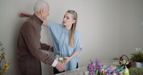 Happy-Easter-Young-Woman-Give-Easter-Gift-To-Grandfather-5