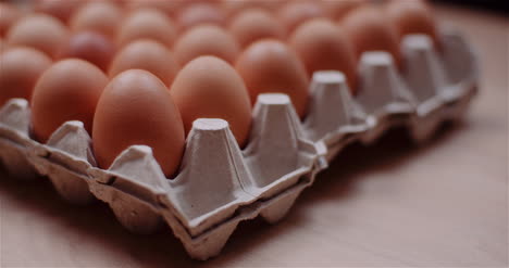 Eggs-Extruder-Full-Of-Fresh-Eggs-On-Black-Background-8