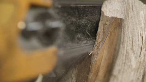 Cutting-Through-Wood-With-Chainsaw-In-Slow-Motion-2