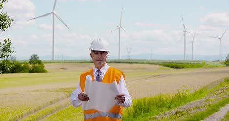 Engineer-Reading-Plan-Against-Wind-Turbine-Farm
