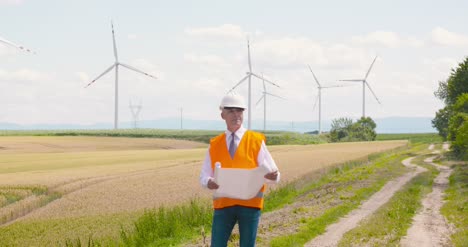 Engineer-Reading-Plan-Against-Wind-Turbine-Farm-3