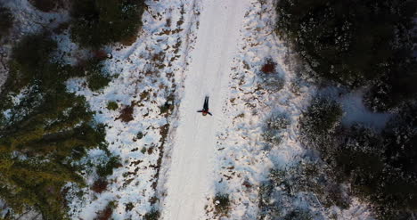 Aerial-Shot-Of-Woman-Playing-On-Snow-1