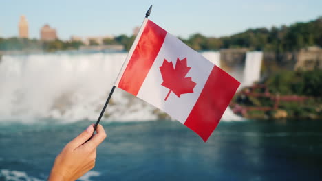 Canadian-Flag-in-Front-of-Niagara-Falls