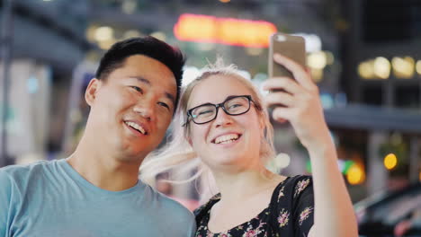 Couple-Take-Selfie-in-City-at-Night