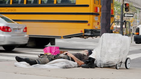 Homeless-Man-Lying-on-Sidewalk