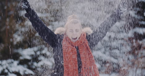 Handful-Of-Snow-Positive-Woman-Throwing-Snow