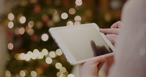 Woman-Using-Digital-Tablet-And-Shopping-Online-During-Christmas-10