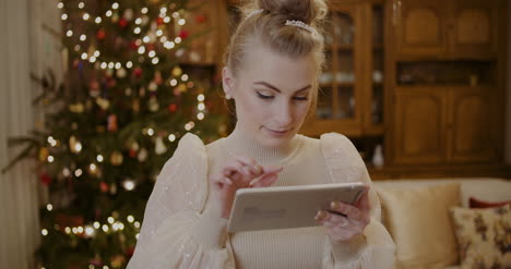 Woman-Using-Digital-Tablet-And-Shopping-Online-During-Christmas-11