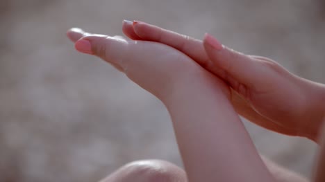 Closeup-Of-Hands-Rubbing-Together-With-Lotion-2