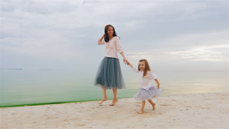 Carefree-Mother-And-Daughter-Three-Years-Running-By-The-Beach