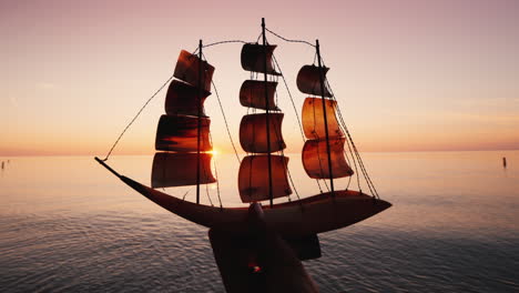 Hand-Raises-A-Sailing-Boat-Inspiration-And-Startup-Concept