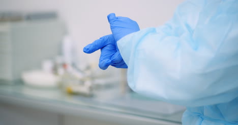 Doctor-Pulls-Off-Protective-Gloves-1