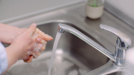 Washing-And-Disinfecting-Hands-In-Sink-1