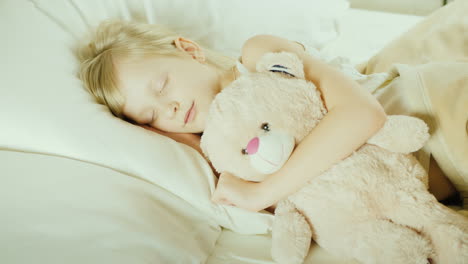Little-Girl-Sleeping-In-Bed-Top-View-23