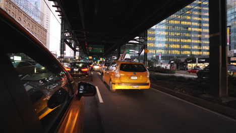 Yellow-Cab-Rides-Under-One-Of-The-Bridges-Of-New-York-Busy-Traffic-To-The-City-Rush-Hour