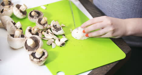 Cuting-Slicing-Mushrooms-In-The-Kitchen-For-Cooking-1