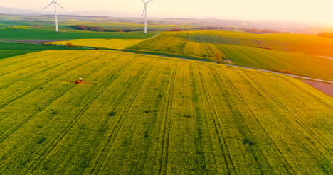 Farmer-Spraying-Colza-Field-With-Pesticide