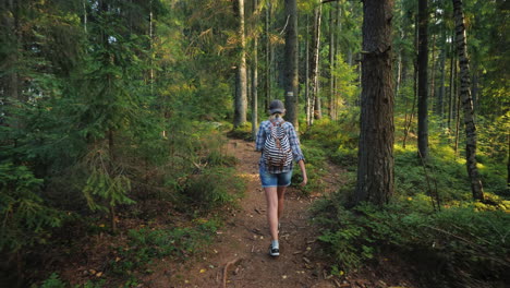 Woman-Tourist-With-A-Backpack-Goes-Along-The-Forest-Path