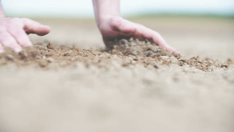 Farmer-Checking-Soil-Before-Planting-Wheat-