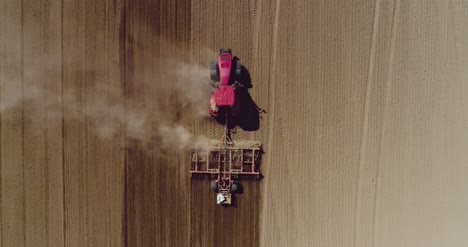Aerial-Of-Tractor-On-Harvest-Field-Ploughing-Agricultural-Field-