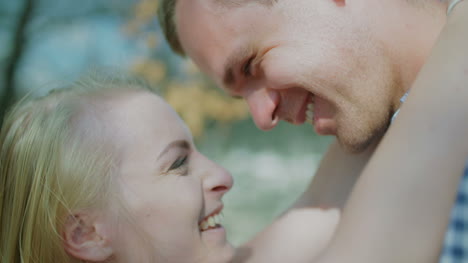 Close-Up-Of-Positive-Loving-Couple-Smiling