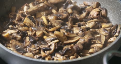 Mushrooms-Being-Cooked-In-Pan-S-1