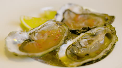 Chef-Preparing-Oysters-Dish-In-Elegant-Restaurant-5
