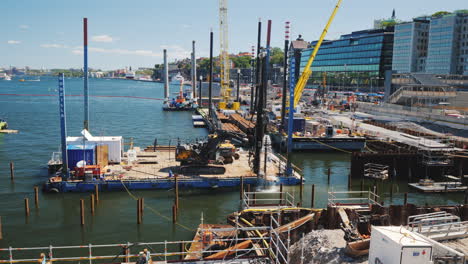 Large-Scale-Construction-On-The-River-Bed-In-Stockholm-On-The-Platform-There-Is-Construction-Equipme