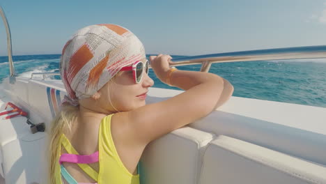 The-Girl-In-The-Bandana-Sails-On-A-Boat-He-Looks-At-Landscapes-Overboard-Summer-Vacation-With-A-Chil