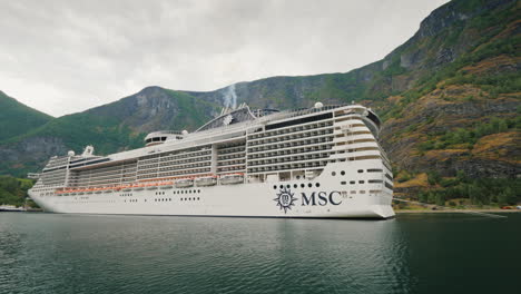 A-Huge-Ocean-Liner-Is-Moored-Off-The-Coast-Of-The-Picturesque-Norwegian-Fjord-4k-Video
