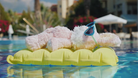 A-Cool-Rabbit-In-Sun-Glasses-Glows-On-An-Inflatable-Mattress-Floats-In-The-Pool-Vacation-With-Childr