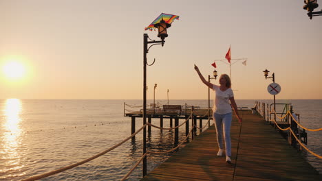 Woman-With-Kite-Runs-Along-The-Beach-Steadicam-Shot