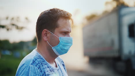 Man-In-A-Protective-Mask-On-A-Dusty-Road-Ecology-Problems-Concept
