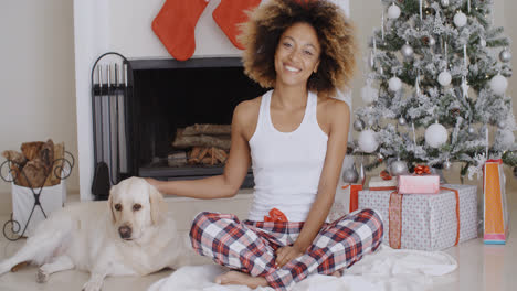 Young-woman-celebrating-Christmas-with-her-dog