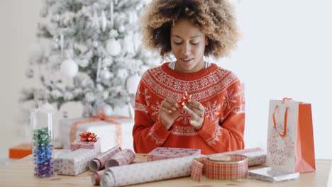 Happy-young-woman-wrapping-presents