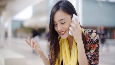 Smiling-happy-woman-using-a-mobile-phone
