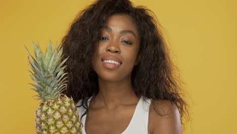 Positive-woman-with-pineapple