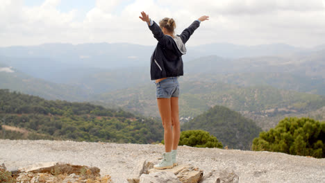 Sporty-Woman-Standing-on-Top-of-Rock