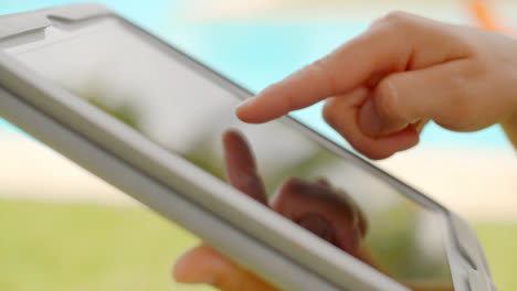 Close-Up-on-Woman-Hands-While-Using-Tablet